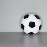 Soccer ball next to wall