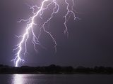 Lightning Striking Ground Near Residential Lake