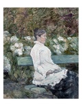 Woman Seated on a Bench in a Park