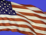American flag unfurled by strong wind