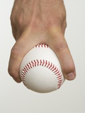 Close up of pitcher holding baseball