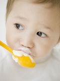 Boy having ice cream with spoon