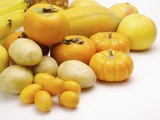 Stack of different kinds of yellow fruits and vegetables