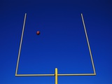 Football Flying Through Goalpost