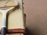 Old Tennis Racket on Suitcase