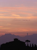 Farmhouse Silhouetted at Sunset