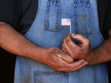 Man Holding Small American Flag