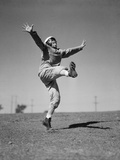Boy Kicking a Football