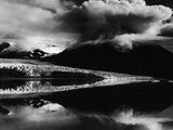 Glacier Feeding into Calm Reflective Lake