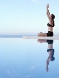 Woman Exercising on Swimming Pool Edge