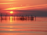 Silhouetted Fishing Net at Sunset