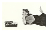 Heavily Browed Lady Listening to Record Player