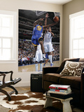 Golden State Warriors v Dallas Mavericks: Reggie Williams and Alexis Ajinca