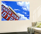 Weather-Beaten Sign of Roadside Hotel