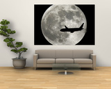 A Jet Plane Passes in Front of the Full Moon Above Surfside  Fla