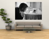 Sen Jack Kennedy Admiring Baby Caroline as She Lies in Her Crib in Nursery at Georgetown Home