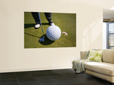 Man Playing Golf with Oversized Ball
