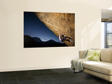Young Woman Climber on Rock Face