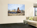 Woman Sitting on Beach with Surfboard at Bondi Beach