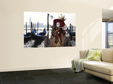 Masked Person in Costume by Gondolas Near St Mark's Square