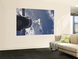 Space Shuttle Atlantis and a Russian Spacecraft Backdropped by a Blue and White Earth