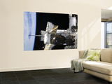 A Docked Soyuz Spacecraft over the Docked Space Shuttle Atlantis