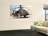 British Soldiers Perform Maintenance on an Apache Helicopter