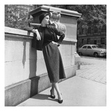 Vogue - October 1952 - Model Leans on Stone Wall