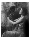Vanity Fair - April 1921 - Woman Holding a Pekingese Dog Aloft