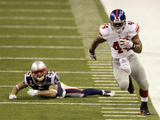 New York Giants and New England Patriots - Super Bowl XLVI - February 5  2012: Ahmad Bradshaw and P