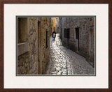 Scooter Riding Down Cobbled Backstreet