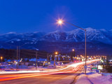 Traffic Flows into Town on Highway 93 at Dusk in Winter in Whitefish  Montana  Usa