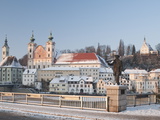 Statue Honouring Townspeople and Baroque Michaelerkirche Church Dating From 1635 at Sunset  Austria