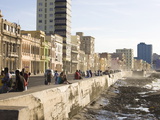 View Along the Malecon  People Sitting on the Seawall Enjoying the Evening Sunshine  Havana  Cuba