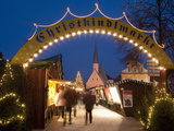 Sign Over Gate and Stalls  Christmas Market (Christkindlmarkt) on Kapellplatz Square  Bavaria