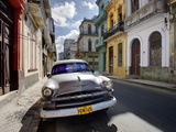 Old American Plymouth Car Parked on Deserted Street of Old Buildings  Havana Centro  Cuba