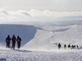 Hikers on Snow Covered Pen Y Fan Mountain  Brecon Beacons National Park  Powys  Wales