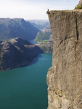 Man Sitting on Preikestolen (Pulpit Rock) Above Fjord  Lysefjord  Norway  Scandinavia  Europe
