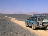Jeep Driving on Stone Desert  Akakus  Sahara Desert  Fezzan  Libya  North Africa  Africa