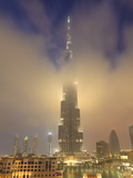 Burj Khalifa Illuminates the Clouds and Surrounding Skyline at Night  Downtown  Dubai  Uae