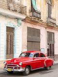 Restrored Red American Car Pakred Outside Faded Colonial Buildings  Havana  Cuba