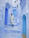 Man in Traditional Moroccan Clothes Walking Down Painted Blue and Steps  Chefchaouen  Morocco