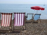 Coloured Deck Chairs on the Pebble Strand  Brighton  Sussex  England  Uk