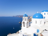 Blue Domed Churches in the Village of Oia  Santorini (Thira)  Cyclades Islands  Aegean Sea  Greece