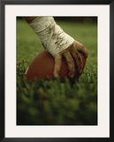 Close-up of the Hand of an American Football Player Holding a Football