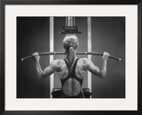 Rear View of a Woman Exercising on a Machine