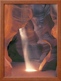 Sunbeam Illuminates Sandy Floor and Sandstone Walls of a Slot Canyon  Antelope Canyon  Page