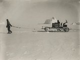 Explorers Guide a Motorized Sledge Hauling Supplies