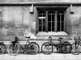 A Row of Bikes Leaning Against an Old School Building in Oxford  England