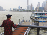 A Man Watching Ferries Crossing the Huangpu River  Shanghai  China  Asia
